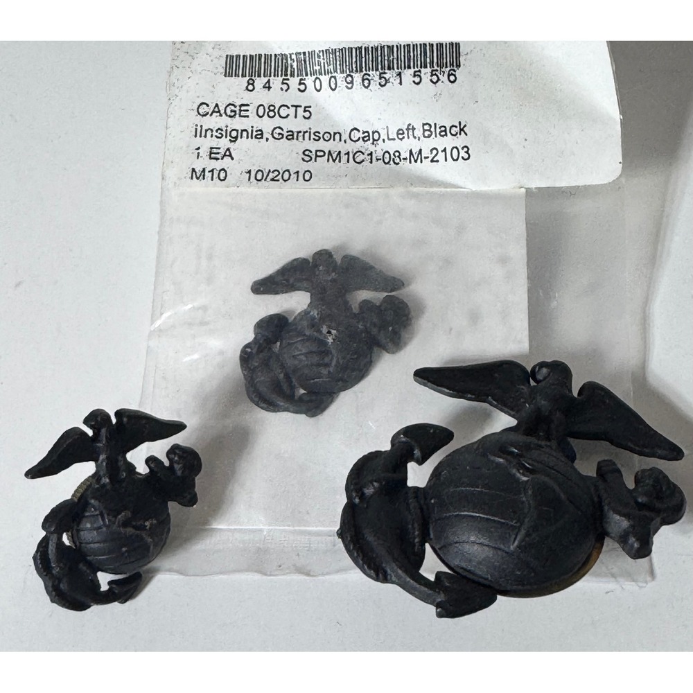 U.S. Marine Corps black Eagle, Globe & Anchor insignia lot.